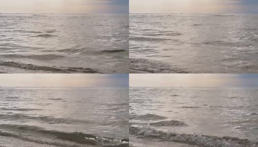 Waves on quiet sandy beach. Slow motion.高清在线视频素材下载