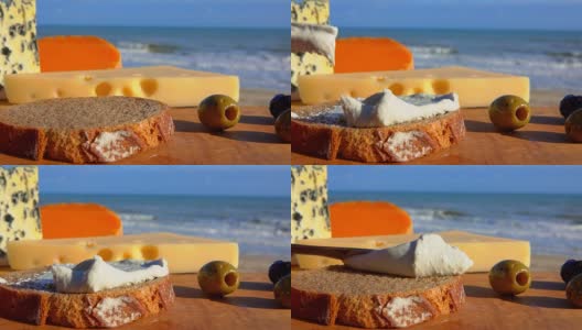 刀子把软奶酪涂在面包上高清在线视频素材下载