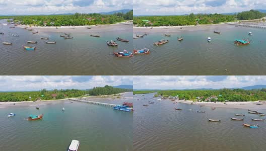 鸟瞰图拍摄热带海滩海与长尾船在泰国南部高清在线视频素材下载