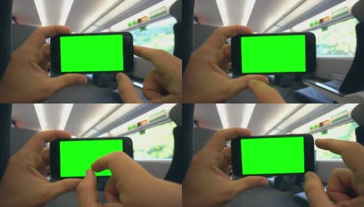 在火车上用手拿着绿屏手机高清在线视频素材下载