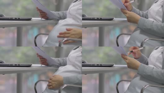 中国怀孕办公室女性正在做她的工作高清在线视频素材下载