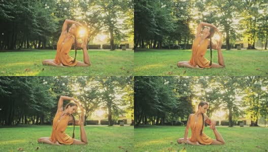 柔韧的年轻女子在阳光公园练习瑜伽高清在线视频素材下载