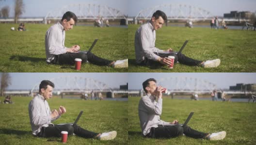 男孩正在检查笔记本电脑，收到了好消息。一个男人坐在公园里，男人刚刚赢得了一个巨大的奖，终于发生了。一个学生，一个自由职业者，微笑着，大笑着。胡椒咖啡。高清在线视频素材下载
