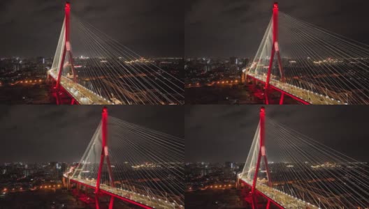 无人机航拍的标志性桥梁城市和城市天际线在夜间高清在线视频素材下载