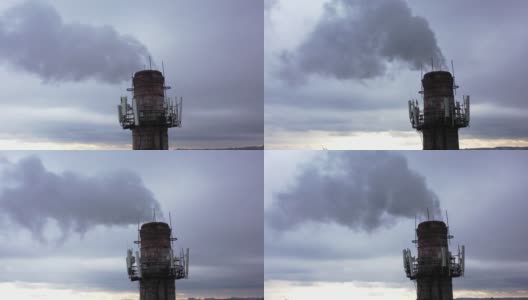 有白烟的烟斗。城市煤气锅炉房的管道，白色的烟雾映衬着天空。从无人机的俯视图。高清在线视频素材下载