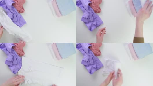 折叠婴儿衣服。玛丽亚近藤方法。整洁的存储。衣服的顺序的概念。t恤和短裤堆放在壁橱里。如何叠衬衫。高清在线视频素材下载