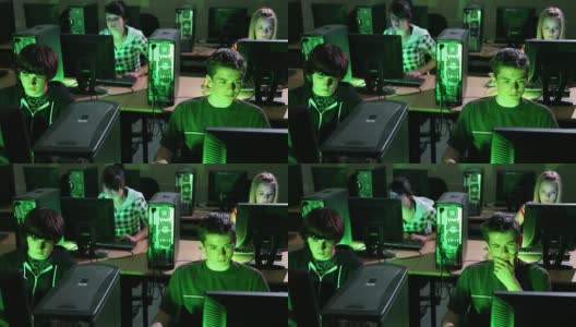 联合反应，高中生一起玩电子游戏，计算机实验室高清在线视频素材下载