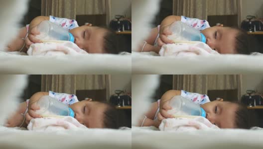 宝宝喝着奶瓶睡觉高清在线视频素材下载