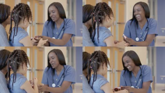 女护士在医院里帮助患有糖尿病的小女孩高清在线视频素材下载