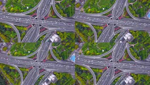 公路交汇处鸟瞰图，形状为字母x交叉。桥梁，道路，或街道与树木的交通概念。中国上海市区建筑的结构形态。高清在线视频素材下载