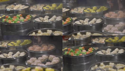 慢镜头小贩在亚洲街头小吃市场卖饺子和烧卖高清在线视频素材下载