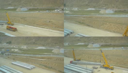 从西藏一条沿河正在建设的公路上俯瞰。高清在线视频素材下载