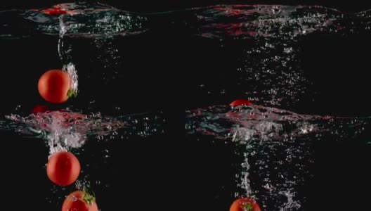 成熟的红番茄掉落到清澈的水中溅起水花高清在线视频素材下载