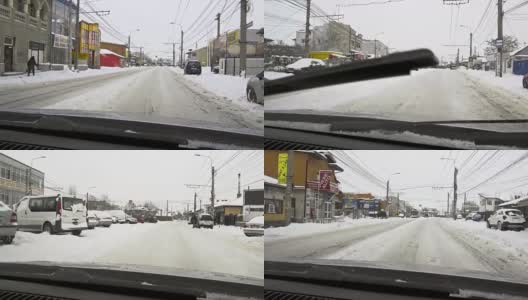 冬天的天气就在汽车路上——飘落的雪花高清在线视频素材下载