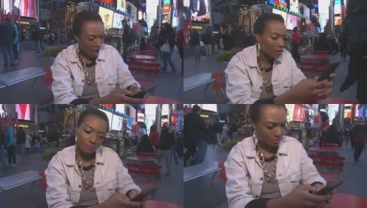 年轻的非洲裔美国妇女在纽约时代广场被情绪征服高清在线视频素材下载