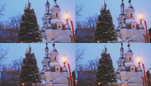 派尔努,爱沙尼亚。圣诞树在节日新年节日照明和圣凯瑟琳东正教教堂的背景高清在线视频素材下载