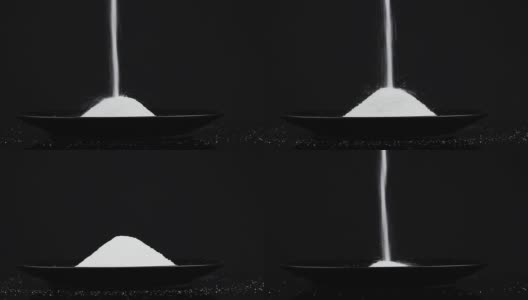 食物倒糖在黑色的背景高清在线视频素材下载