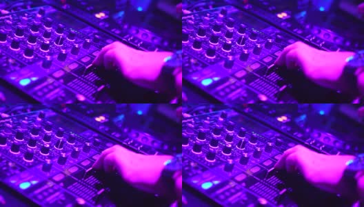 DJ的手在DJ的甲板上调整各种轨道控制高清在线视频素材下载