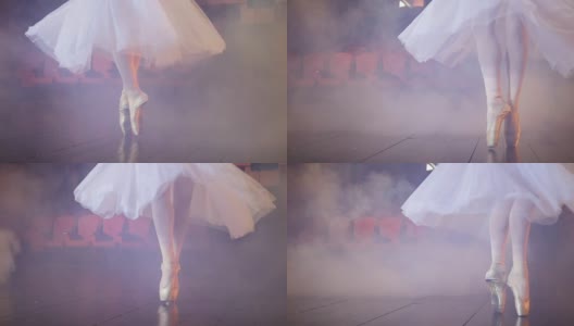 在雾气弥漫的房间里跳舞的芭蕾舞者的脚。高清在线视频素材下载