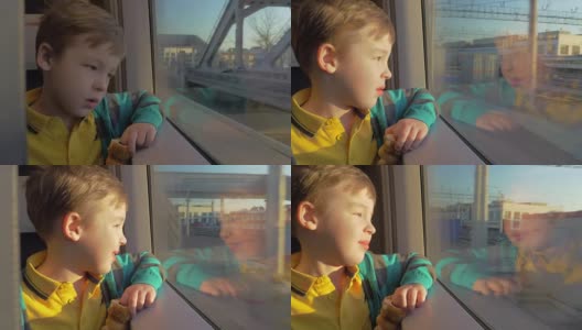 在俄罗斯的圣彼得堡，火车上坐着一个小男孩，他拿着一个玩具望着窗外高清在线视频素材下载