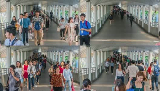 在曼谷BTS Chong Nonsi的高峰时刻，拥挤的人在高架地铁系统站的天桥上行走，交通和乘客旅行的概念高清在线视频素材下载