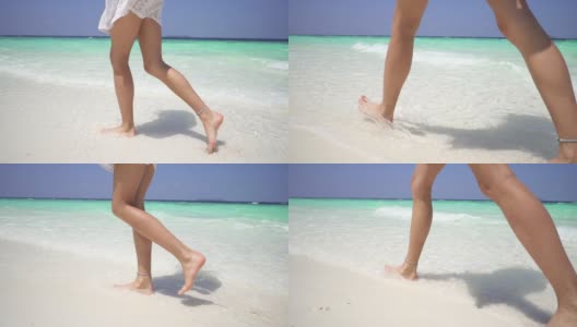 年轻的光着脚的女人走在马尔代夫海岸附近的白色沙滩上。缓慢的运动。高清在线视频素材下载