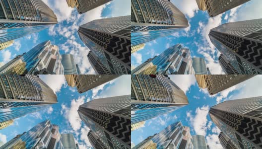 4K时间流逝芝加哥市中心摩天大楼的上升角度与高楼之间的云反射，伊利诺伊州，美国，商业和透视概念高清在线视频素材下载