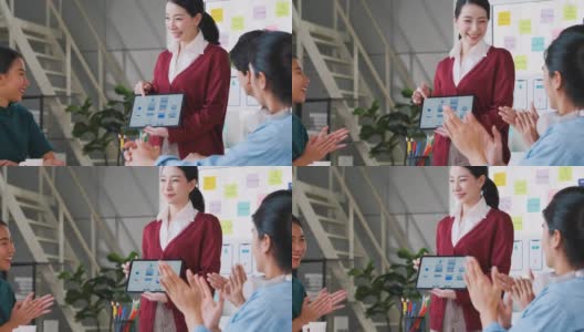 亚洲用户体验开发者和ui设计师在现代办公室会议的白板上展示手机应用界面原型设计。创意数字开发移动应用机构高清在线视频素材下载