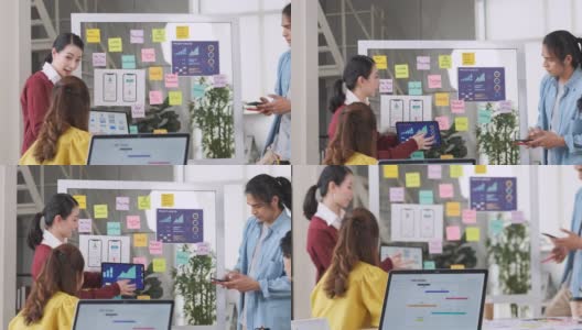 亚洲用户体验开发人员和ui设计师在现代办公室会议的白板上展示和测试手机应用界面设计。创意数字开发移动应用机构高清在线视频素材下载