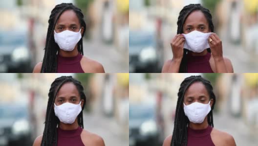 非洲黑人妇女在城市街道上进行covid-19口罩预防工作高清在线视频素材下载