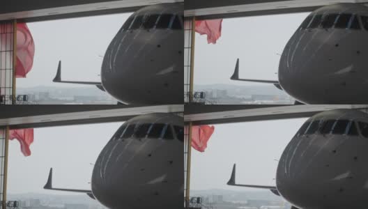 在着陆场附近土耳其红旗随风飘扬的巨大机库中，飞机的雷达圆顶高清在线视频素材下载