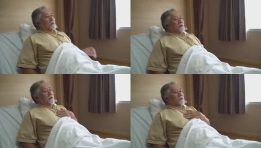 亚洲老病人坐在床上向医院的医生解释他的病情高清在线视频素材下载