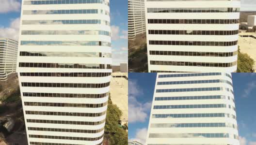 办公楼建筑映衬着蓝天白云高清在线视频素材下载