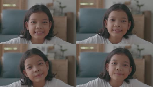 描绘亚洲小女孩在家里开心的笑容高清在线视频素材下载