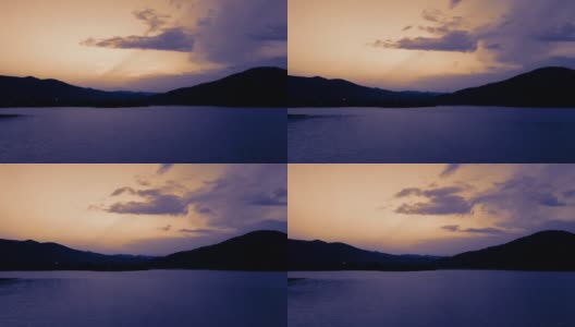 美丽的电影观日落在湖边与山丘高清在线视频素材下载