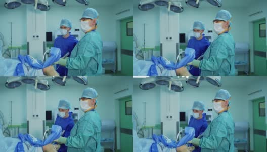 外科医生和助理进行内窥镜手术，使用现代化设备高清在线视频素材下载