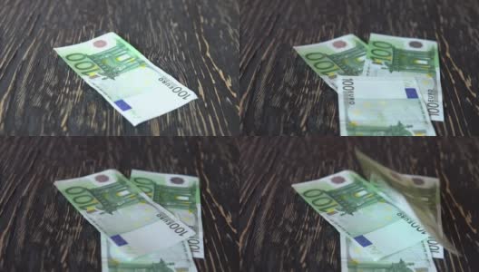 欧元纸币。钱落在木制的背景上高清在线视频素材下载
