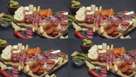 肉盘-意大利腊肠和西班牙辣香肠靠近木板高清在线视频素材下载