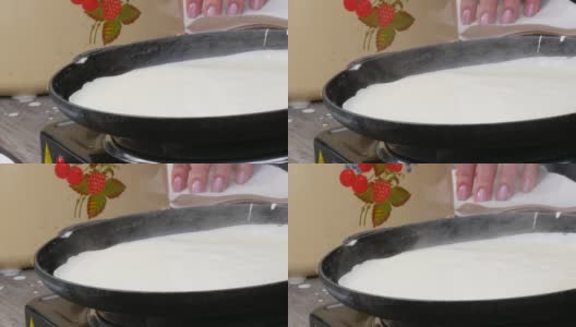 用来煎生面团做薄饼的大煎锅。Maslenitsa节日，斯拉夫人春季聚会的重要庆祝活动，街头美食节高清在线视频素材下载