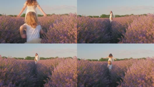 日落时分，母女俩走过一片薰衣草田。热爱自然，香薰，香薰油。自由，幸福，微笑，家人在一起。美丽的花朵。高清在线视频素材下载