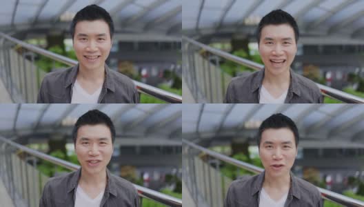 近脸肖像迷人的亚洲男子短发自信的微笑充满积极的热情。快乐来自健康。对着镜头说话。积极思考的概念高清在线视频素材下载