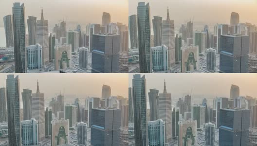 在卡塔尔首都多哈的商业中心，日落前的摩天大楼在天际线上缓缓落下高清在线视频素材下载