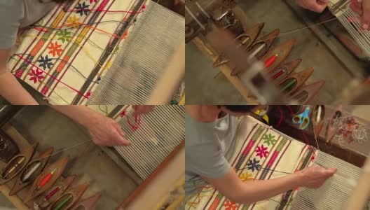 在织布机上织地毯的女人。手工制作的地毯高清在线视频素材下载