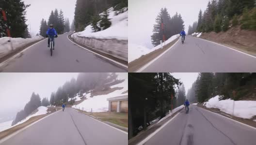 老年人在冬季的山路上骑车高清在线视频素材下载