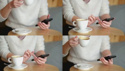 女人在餐桌上写作，喝咖啡或茶。她一边搅拌杯子一边看手机。特写镜头高清在线视频素材下载