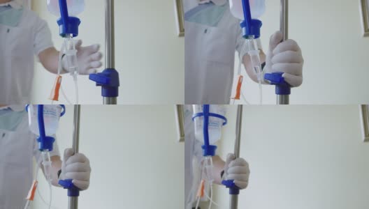 护士在病房移动生理盐水站高清在线视频素材下载