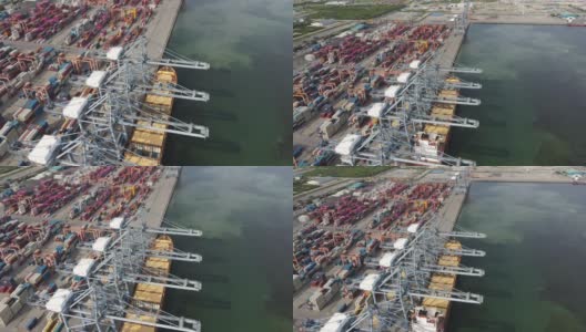 4K鸟瞰图多式联运船坞与一艘装载的集装箱船停靠在东南亚泰国的港口高清在线视频素材下载