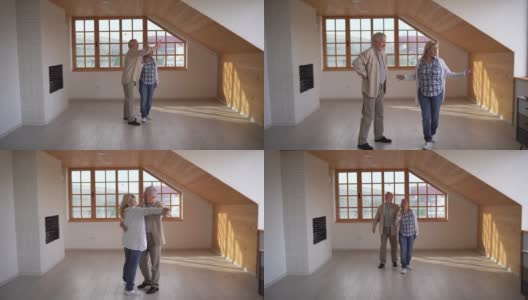 快乐的高年级情侣在他们的新公寓里跳舞庆祝高清在线视频素材下载