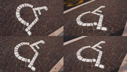 在人行道上用石头铺的残疾人标志上方移动高清在线视频素材下载