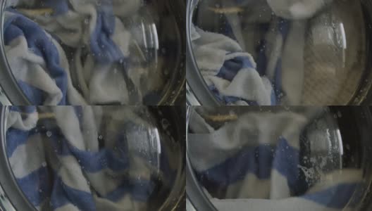 毛巾在洗衣机中洗涤的慢动作高清在线视频素材下载
